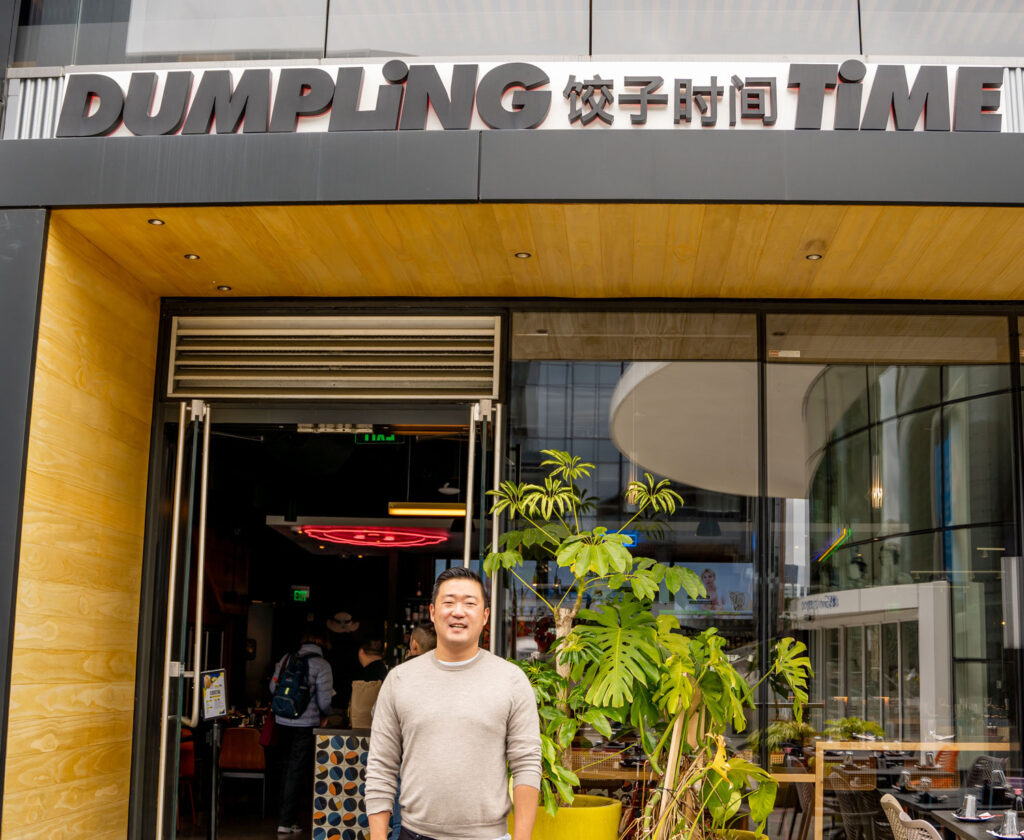 Min Park standing in front of his Dumpling time restaurant.